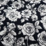 WHITE AND BLACK ROSES ON BLACK BACKGROUND