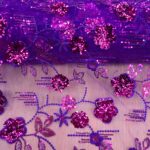 EMB CERISE SQUIN ON PURPLE TULLE