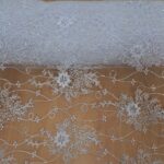 WHITE ON WHITE TULLE