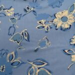 WHITE FLOWERS ON PALE BLUE