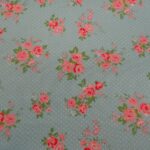 PINKS FLOWERS ON PALE BLUE WITH WHITE SPOTS