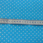 WHITE PIN SPOTS ON TURQUOISE