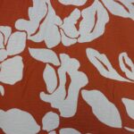IVORY FLORAL ON TEXTURED RUST