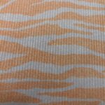 TIGER STRIPES AND ORANGE ON PLY PINK RIBBED JERSEY