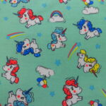 MULTI COLOURED UNICORNS ON MINT BACKGROUND