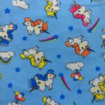 COLOURFUL UNICORNS ON PALE BLUE BACKGROUND