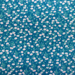 CREAM/PINK FLOWERS ON TEAL BACKGROUND