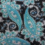 TURQUOISE/CREAM ON BLACK BACKGROUND