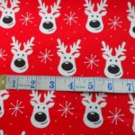 SMILING REINDEERS ON RED BACKGROUND