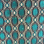 JADE SPOTS ON A BLACK BACKGROUND